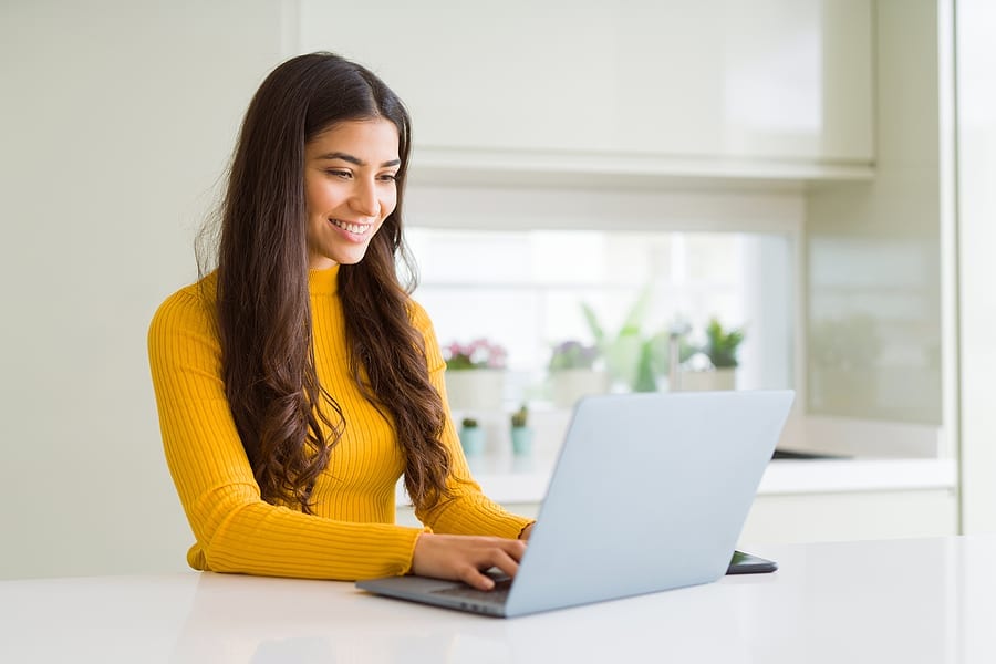 Beauitul young woman working using computer laptop concentrated