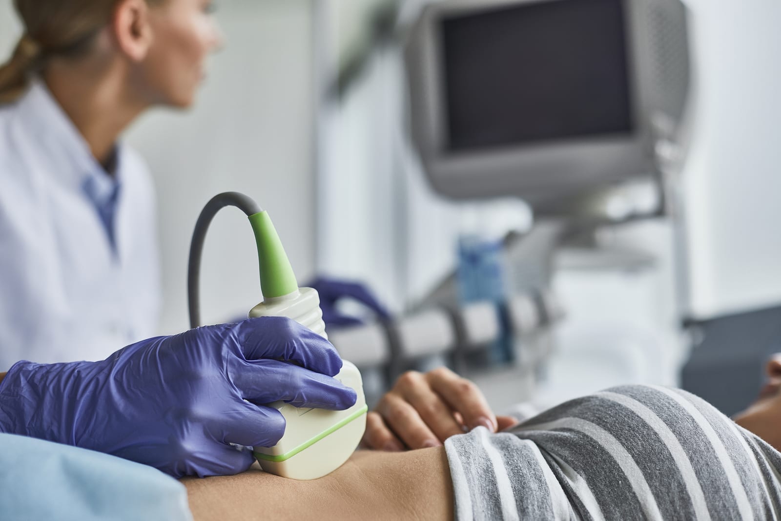 Doctor Checking Woman Pregnancy During Sonography Examination