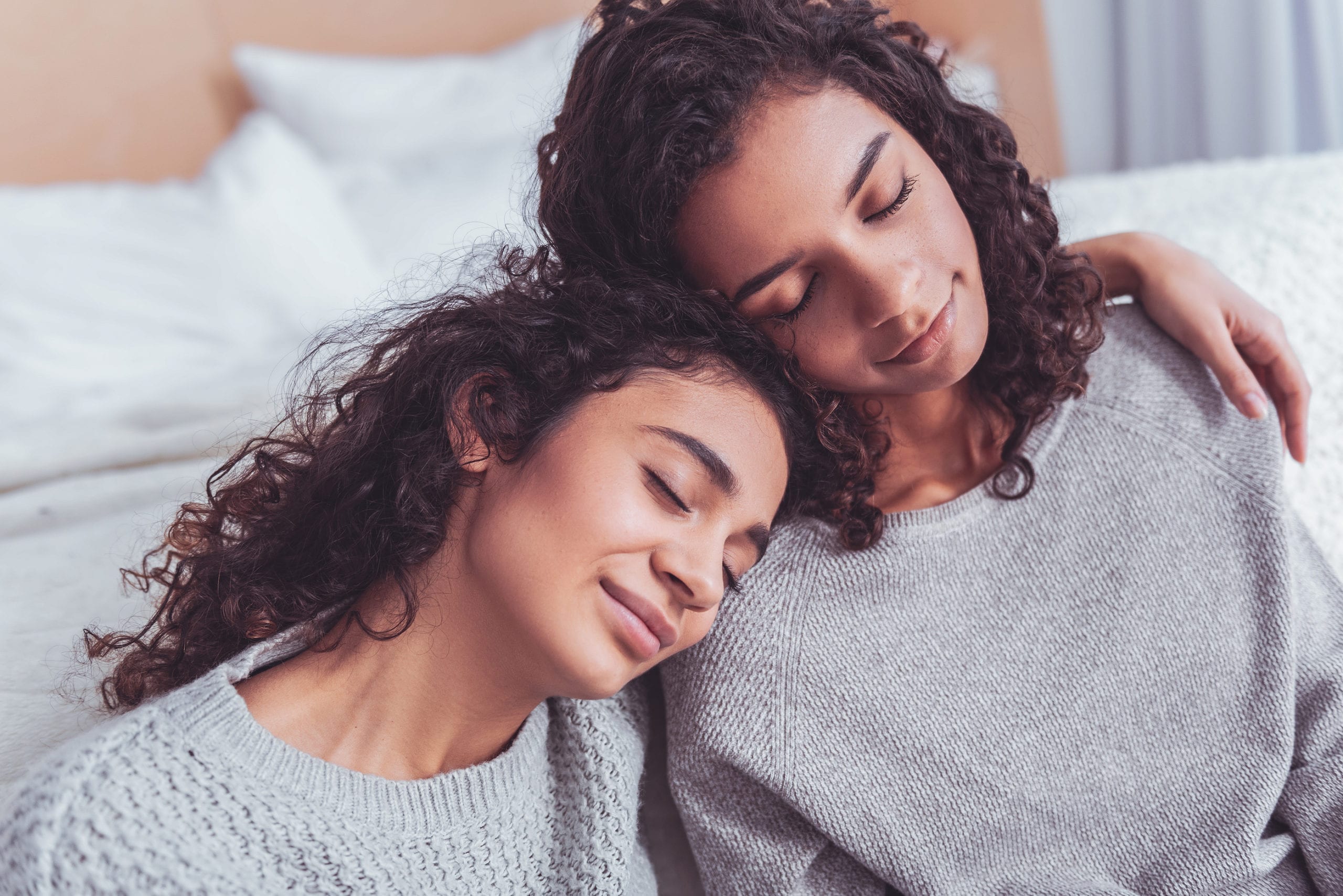 Two Cheerful Cousins Feeling Relieved After Conversation