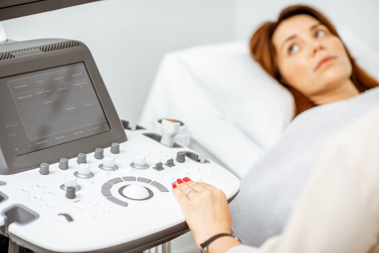 Woman Examining Her Pelvic Organs With Ultrasound Sensor Or Diag